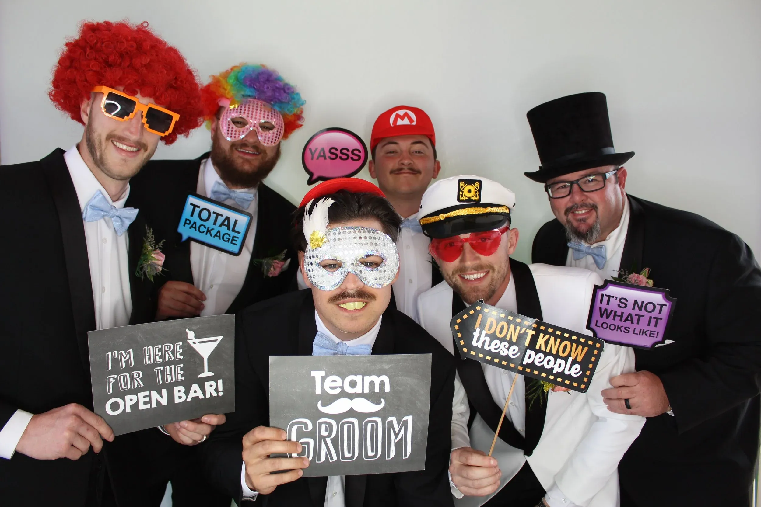 Friends celebrating in the photo booth